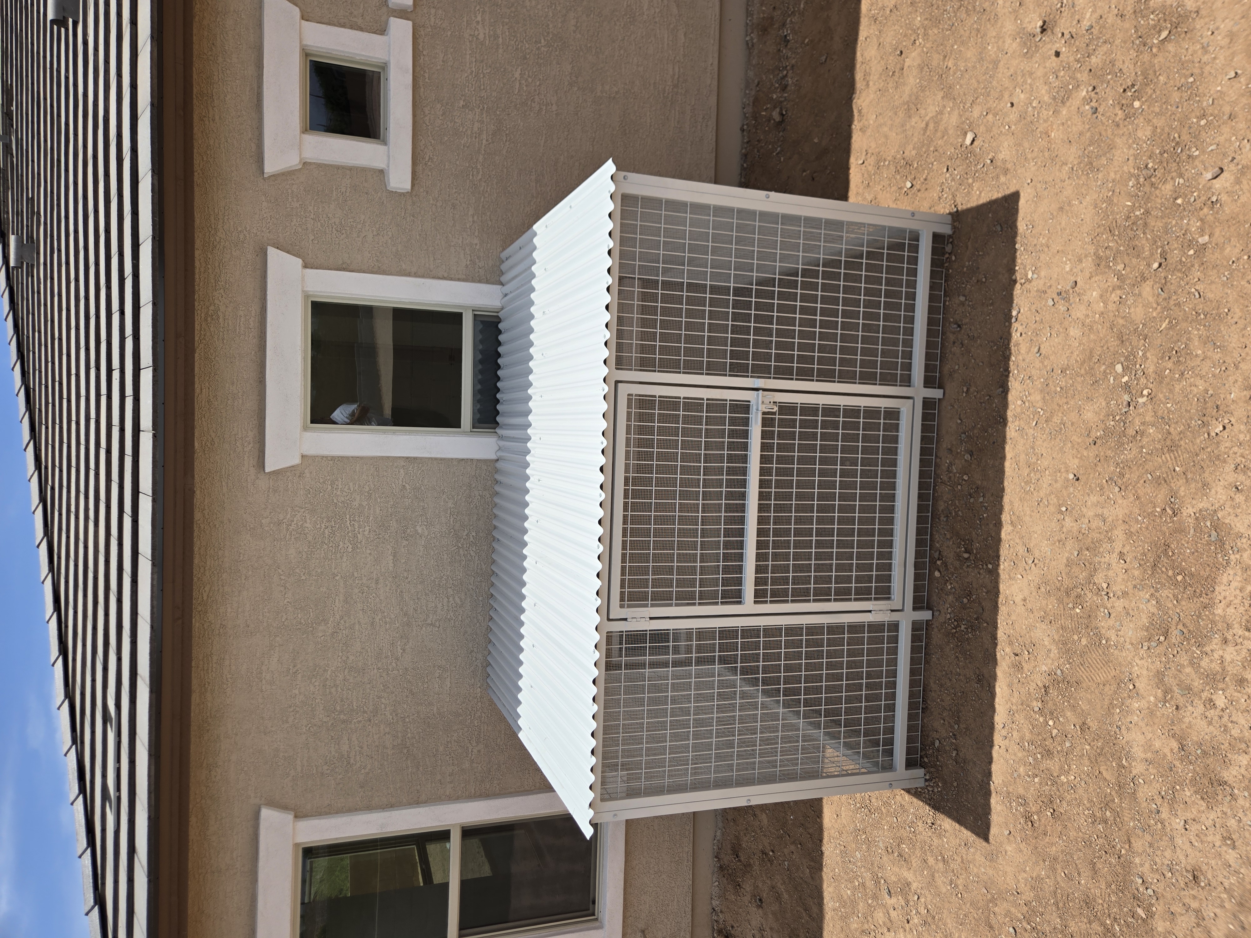 Heavy-duty white dog kennel built for long-term outdoor use